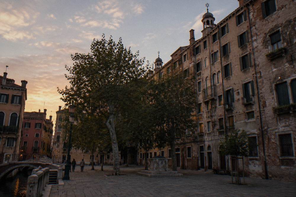 Enclosed square with trees and tall historic buildings in the Venice Ghetto