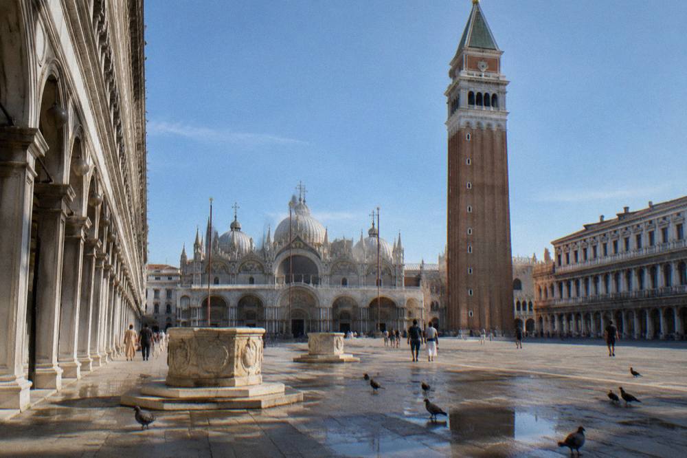 Wide view of St Mark's Square with the Basilica facade and the Campanile in clear morning light